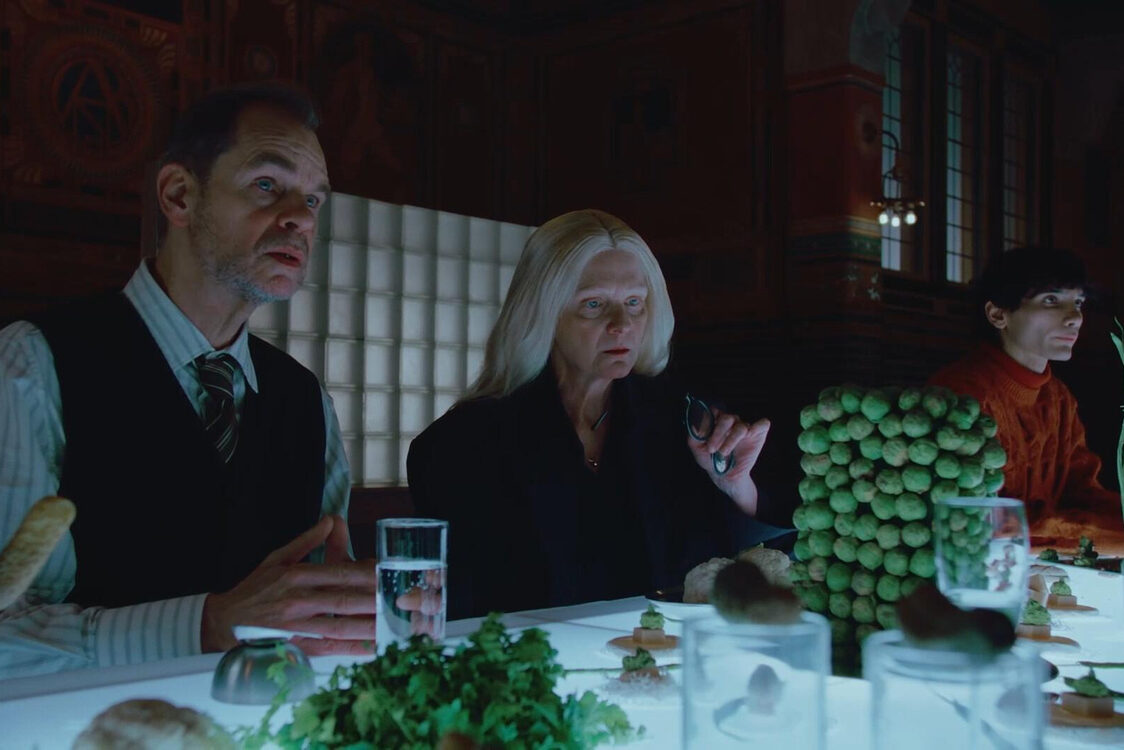 art direction - Studio Gerritsen-Bart lit table with people eating futuristic food like stacked sprouts